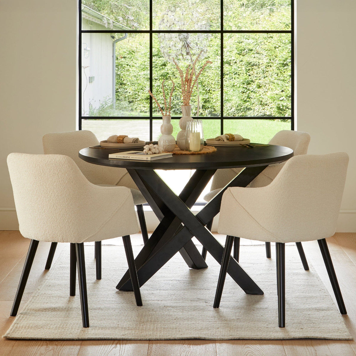 Levi Black Round Dining Table Set - 4 Seater - Freya Boucle Armchairs with Black Legs