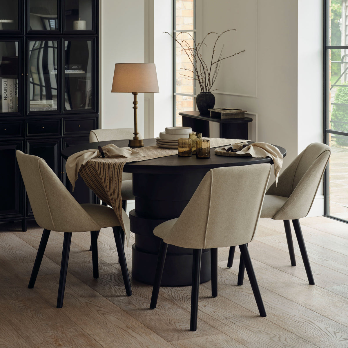 Adam 135cm Jet Black Mango Wood Round Dining Table Set - 4 Seater - Freya Sand Dining Chair - Black Oak Legs