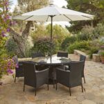 Kemble 6 Seater Rattan Round Garden Dining Set with Cream LED Premium Parasol - Black Weave